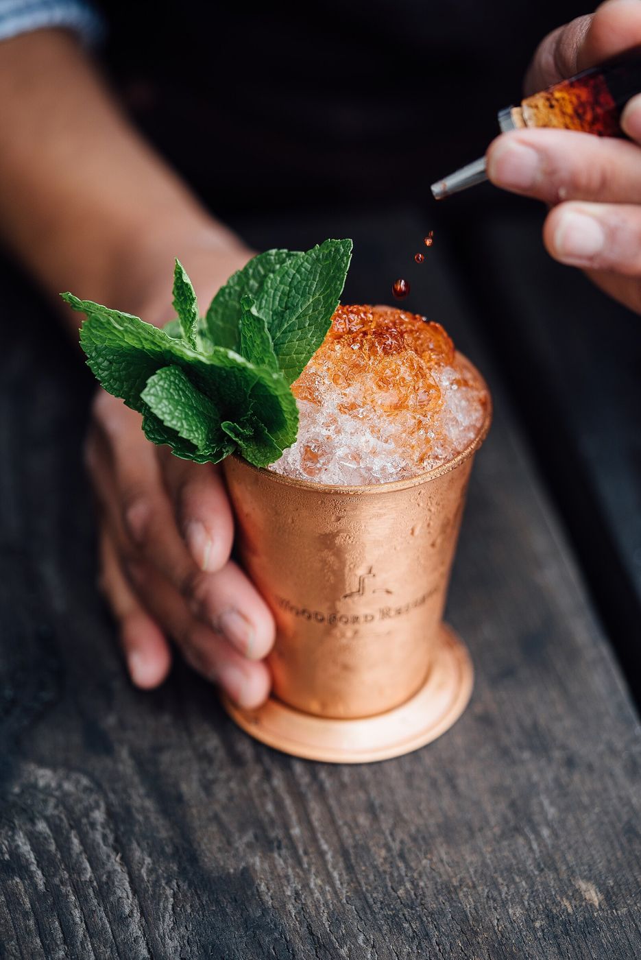 A signature mocktail garnished with mint
